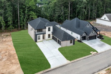 This contemporary home is brimming with amenities, featuring on Chenal Country Club - Bear Den Mountain in Arkansas - for sale on GolfHomes.com, golf home, golf lot