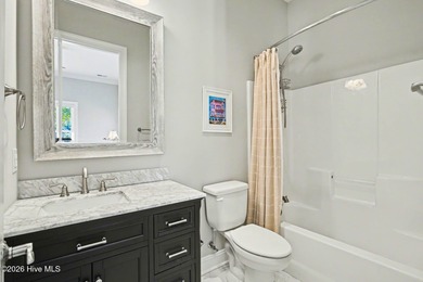 Exquisite Low Country Estate with Tee-to-Hole Golf Course & Pond on Ocean Ridge Plantation in North Carolina - for sale on GolfHomes.com, golf home, golf lot