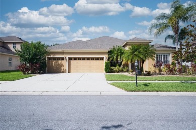 Stunning 4-Bedroom Pool Home with Office  Bonus Room in Gated on Heritage Isles Golf and Country Club in Florida - for sale on GolfHomes.com, golf home, golf lot