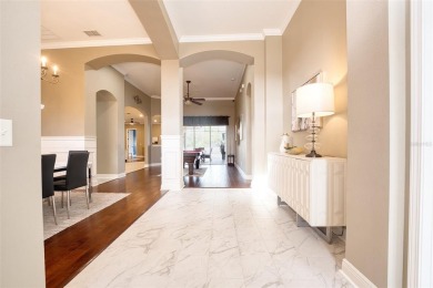 Stunning 4-Bedroom Pool Home with Office  Bonus Room in Gated on Heritage Isles Golf and Country Club in Florida - for sale on GolfHomes.com, golf home, golf lot