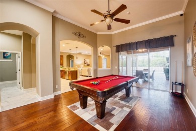 Stunning 4-Bedroom Pool Home with Office  Bonus Room in Gated on Heritage Isles Golf and Country Club in Florida - for sale on GolfHomes.com, golf home, golf lot