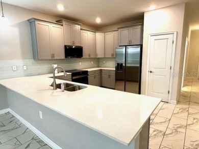 This spacious 8-bedroom, 5-bathroom home in a gated community on The Oasis Club at Champions Gate in Florida - for sale on GolfHomes.com, golf home, golf lot