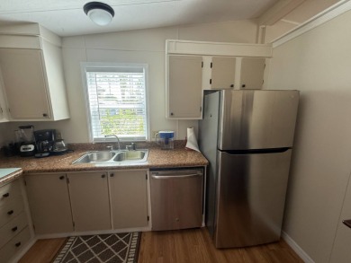 This well-cared for 2-bedroom, 2-bathroom home is being sold on Del Tura Golf and Country Club in Florida - for sale on GolfHomes.com, golf home, golf lot