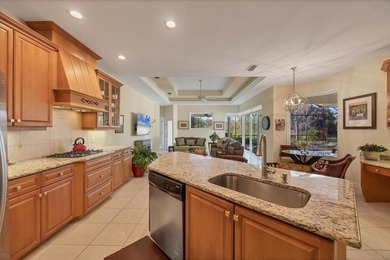 A captivating lake view with mature trees draws you in the on Legacy Golf Club in Florida - for sale on GolfHomes.com, golf home, golf lot