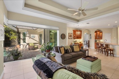A captivating lake view with mature trees draws you in the on Legacy Golf Club in Florida - for sale on GolfHomes.com, golf home, golf lot