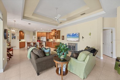 A captivating lake view with mature trees draws you in the on Legacy Golf Club in Florida - for sale on GolfHomes.com, golf home, golf lot