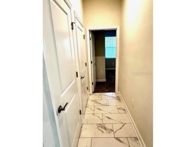This spacious 8-bedroom, 5-bathroom home in a gated community on The Oasis Club at Champions Gate in Florida - for sale on GolfHomes.com, golf home, golf lot