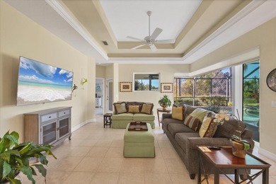 A captivating lake view with mature trees draws you in the on Legacy Golf Club in Florida - for sale on GolfHomes.com, golf home, golf lot