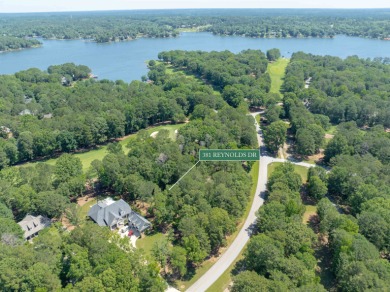 Set along the tranquil 12th green of the prestigious Jack on Great Waters Course At Reynolds Plantation in Georgia - for sale on GolfHomes.com, golf home, golf lot