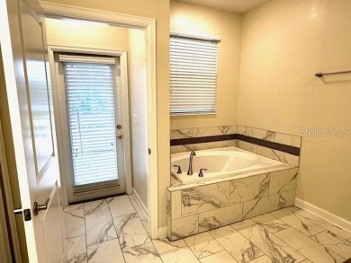 This spacious 8-bedroom, 5-bathroom home in a gated community on The Oasis Club at Champions Gate in Florida - for sale on GolfHomes.com, golf home, golf lot