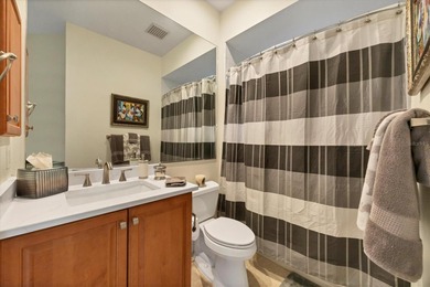 A captivating lake view with mature trees draws you in the on Legacy Golf Club in Florida - for sale on GolfHomes.com, golf home, golf lot