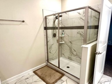 This spacious 8-bedroom, 5-bathroom home in a gated community on The Oasis Club at Champions Gate in Florida - for sale on GolfHomes.com, golf home, golf lot