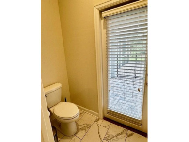 This spacious 8-bedroom, 5-bathroom home in a gated community on The Oasis Club at Champions Gate in Florida - for sale on GolfHomes.com, golf home, golf lot