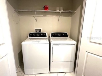 This spacious 8-bedroom, 5-bathroom home in a gated community on The Oasis Club at Champions Gate in Florida - for sale on GolfHomes.com, golf home, golf lot