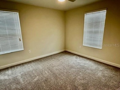 This spacious 8-bedroom, 5-bathroom home in a gated community on The Oasis Club at Champions Gate in Florida - for sale on GolfHomes.com, golf home, golf lot