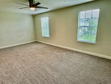 This spacious 8-bedroom, 5-bathroom home in a gated community on The Oasis Club at Champions Gate in Florida - for sale on GolfHomes.com, golf home, golf lot