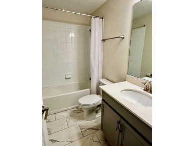 This spacious 8-bedroom, 5-bathroom home in a gated community on The Oasis Club at Champions Gate in Florida - for sale on GolfHomes.com, golf home, golf lot