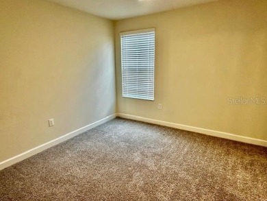 This spacious 8-bedroom, 5-bathroom home in a gated community on The Oasis Club at Champions Gate in Florida - for sale on GolfHomes.com, golf home, golf lot