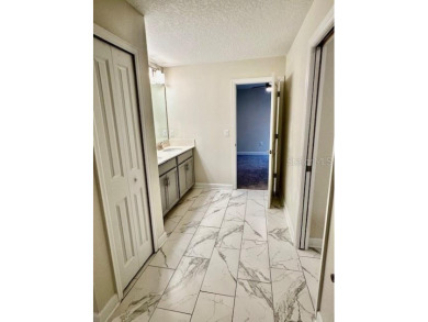 This spacious 8-bedroom, 5-bathroom home in a gated community on The Oasis Club at Champions Gate in Florida - for sale on GolfHomes.com, golf home, golf lot