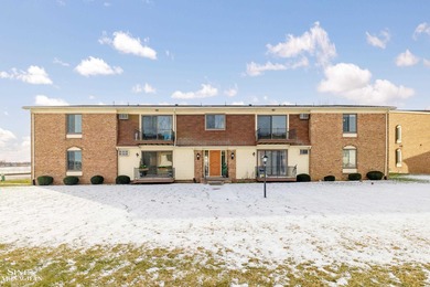 This upper-floor 2-bedroom condo offers beautiful views of the on Marysville Golf Course in Michigan - for sale on GolfHomes.com, golf home, golf lot