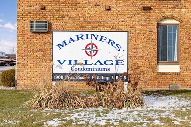 This upper-floor 2-bedroom condo offers beautiful views of the on Marysville Golf Course in Michigan - for sale on GolfHomes.com, golf home, golf lot