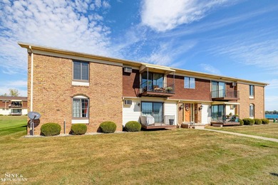 This upper-floor 2-bedroom condo offers beautiful views of the on Marysville Golf Course in Michigan - for sale on GolfHomes.com, golf home, golf lot