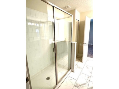 This spacious 8-bedroom, 5-bathroom home in a gated community on The Oasis Club at Champions Gate in Florida - for sale on GolfHomes.com, golf home, golf lot