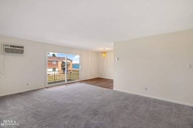 This upper-floor 2-bedroom condo offers beautiful views of the on Marysville Golf Course in Michigan - for sale on GolfHomes.com, golf home, golf lot