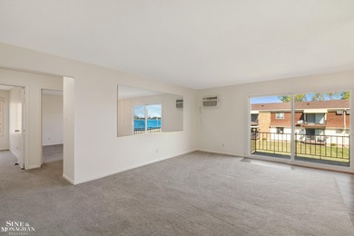 This upper-floor 2-bedroom condo offers beautiful views of the on Marysville Golf Course in Michigan - for sale on GolfHomes.com, golf home, golf lot