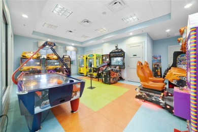 This spacious 8-bedroom, 5-bathroom home in a gated community on The Oasis Club at Champions Gate in Florida - for sale on GolfHomes.com, golf home, golf lot