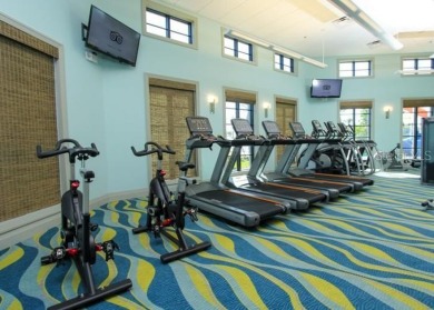 This spacious 8-bedroom, 5-bathroom home in a gated community on The Oasis Club at Champions Gate in Florida - for sale on GolfHomes.com, golf home, golf lot