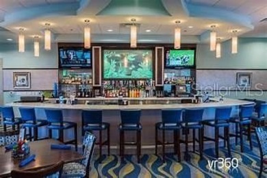 This spacious 8-bedroom, 5-bathroom home in a gated community on The Oasis Club at Champions Gate in Florida - for sale on GolfHomes.com, golf home, golf lot