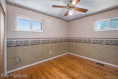 Situated at the end of a quiet cul-de-sac, this well-maintained on St. Clair Shores Country Club in Michigan - for sale on GolfHomes.com, golf home, golf lot