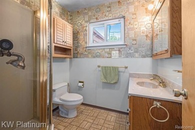 Situated at the end of a quiet cul-de-sac, this well-maintained on St. Clair Shores Country Club in Michigan - for sale on GolfHomes.com, golf home, golf lot