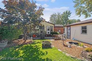 Situated at the end of a quiet cul-de-sac, this well-maintained on St. Clair Shores Country Club in Michigan - for sale on GolfHomes.com, golf home, golf lot