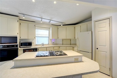 Priced for immediate sale. Cash only. This Jacobson Island on Barefoot Bay Golf Course in Florida - for sale on GolfHomes.com, golf home, golf lot