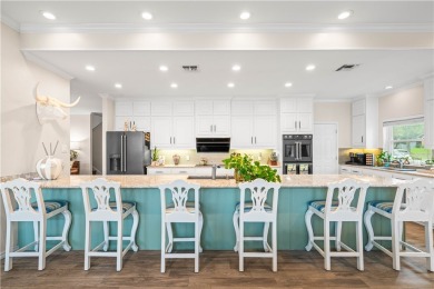 Welcome to 2110 Harbor Ct, a custom waterfront retreat located on Rockport Country Club in Texas - for sale on GolfHomes.com, golf home, golf lot