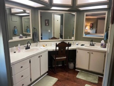 Stunningly immaculate home on the fifteenth tee of the Lake on Pine Lakes Country Club in Florida - for sale on GolfHomes.com, golf home, golf lot