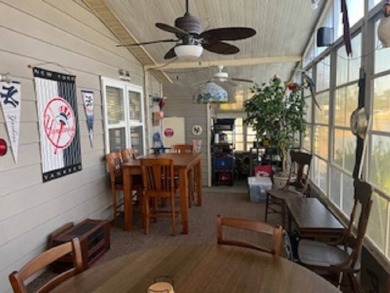 Stunningly immaculate home on the fifteenth tee of the Lake on Pine Lakes Country Club in Florida - for sale on GolfHomes.com, golf home, golf lot