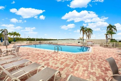 Discover your own slice of paradise in this beautiful 2-bedroom on Isla Del Sol Yacht and Country Club in Florida - for sale on GolfHomes.com, golf home, golf lot