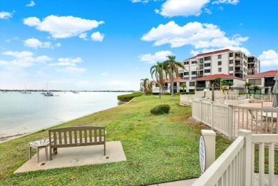 Discover your own slice of paradise in this beautiful 2-bedroom on Isla Del Sol Yacht and Country Club in Florida - for sale on GolfHomes.com, golf home, golf lot
