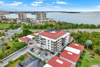 Discover your own slice of paradise in this beautiful 2-bedroom on Isla Del Sol Yacht and Country Club in Florida - for sale on GolfHomes.com, golf home, golf lot