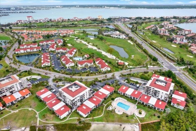Discover your own slice of paradise in this beautiful 2-bedroom on Isla Del Sol Yacht and Country Club in Florida - for sale on GolfHomes.com, golf home, golf lot