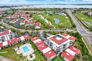 Discover your own slice of paradise in this beautiful 2-bedroom on Isla Del Sol Yacht and Country Club in Florida - for sale on GolfHomes.com, golf home, golf lot