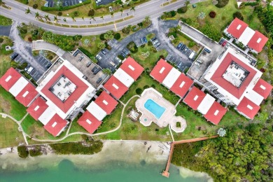 Discover your own slice of paradise in this beautiful 2-bedroom on Isla Del Sol Yacht and Country Club in Florida - for sale on GolfHomes.com, golf home, golf lot