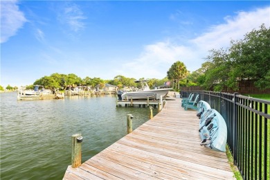 Welcome to 2110 Harbor Ct, a custom waterfront retreat located on Rockport Country Club in Texas - for sale on GolfHomes.com, golf home, golf lot