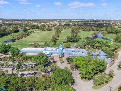 Desirable 2BR/2BA end-unit villa with expansive lake views in on Deer Creek Golf Club in Florida - for sale on GolfHomes.com, golf home, golf lot