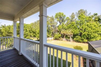 Come enjoy the cool breeze blowing across the front porch of on Haile Plantation Golf and Country Club in Florida - for sale on GolfHomes.com, golf home, golf lot