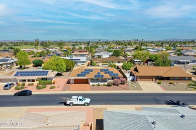 Charming 3-bedroom, 2-bath home featuring a spacious Arizona on Sun City Lakes West and East in Arizona - for sale on GolfHomes.com, golf home, golf lot