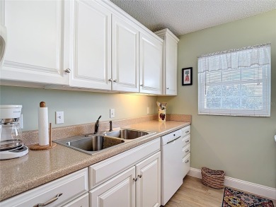 Turnkey completely furnished. Take the elevator or stairs to on Zephyrhills Municipal Golf Course in Florida - for sale on GolfHomes.com, golf home, golf lot